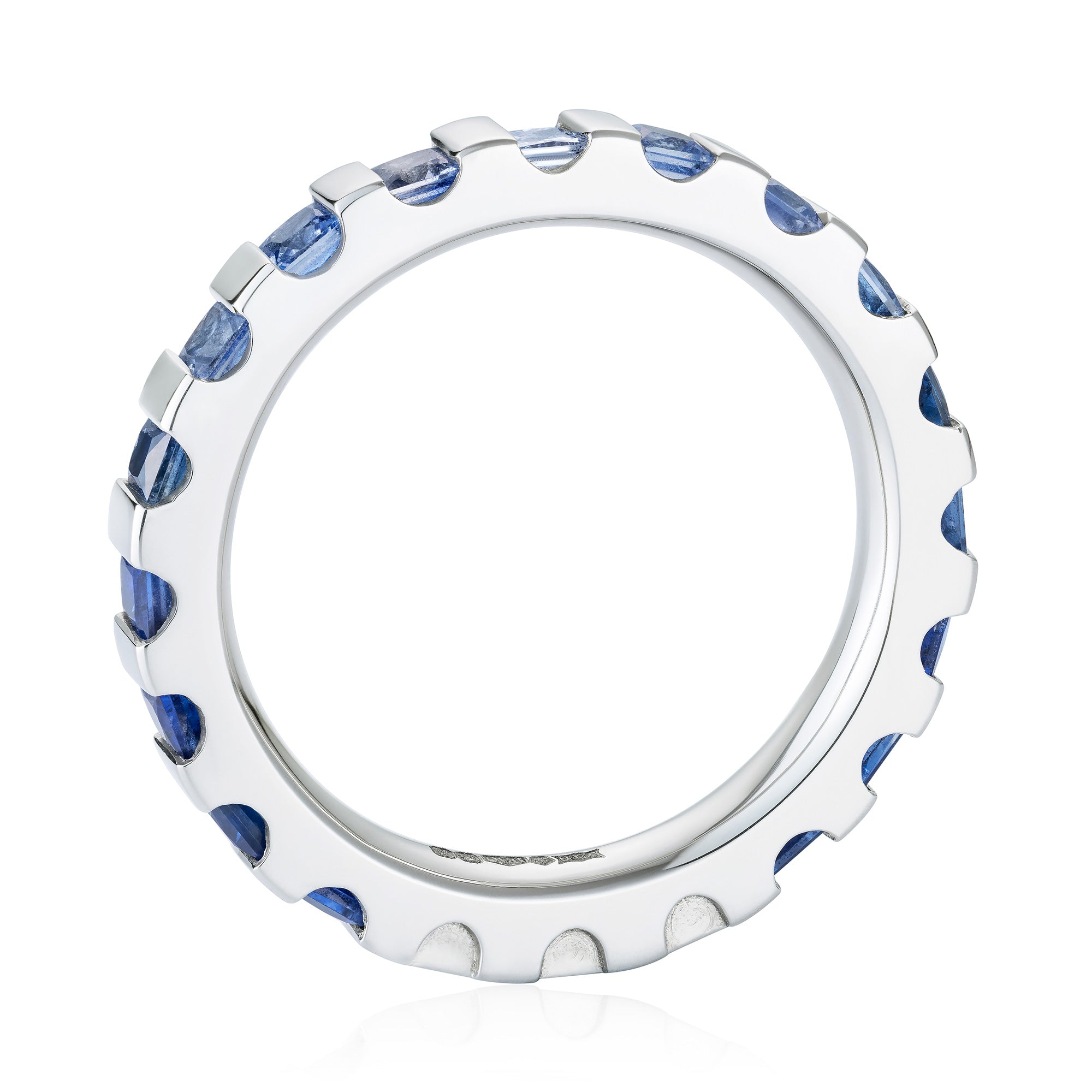 Platinum eternity ring white diamond in the centre, going out from light blue to deep blue sapphires. Through view.