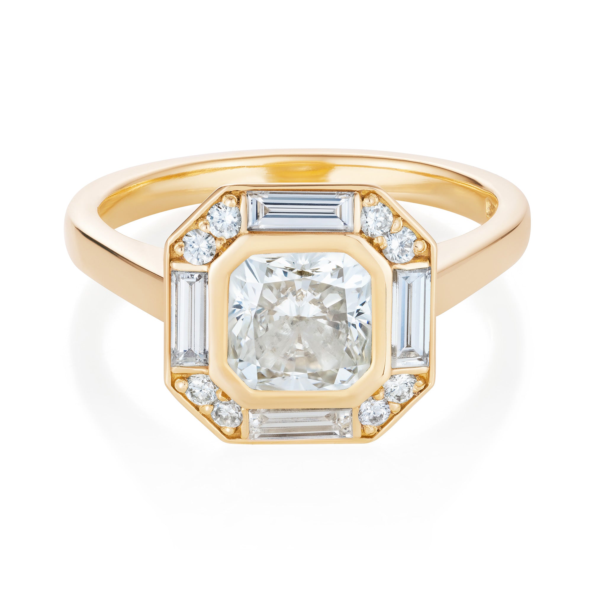 Yellow gold engagement ring with a warm cushion cut diamond in a halo of baguette and round diamonds. Designed by Yasmin Everley. Front view.