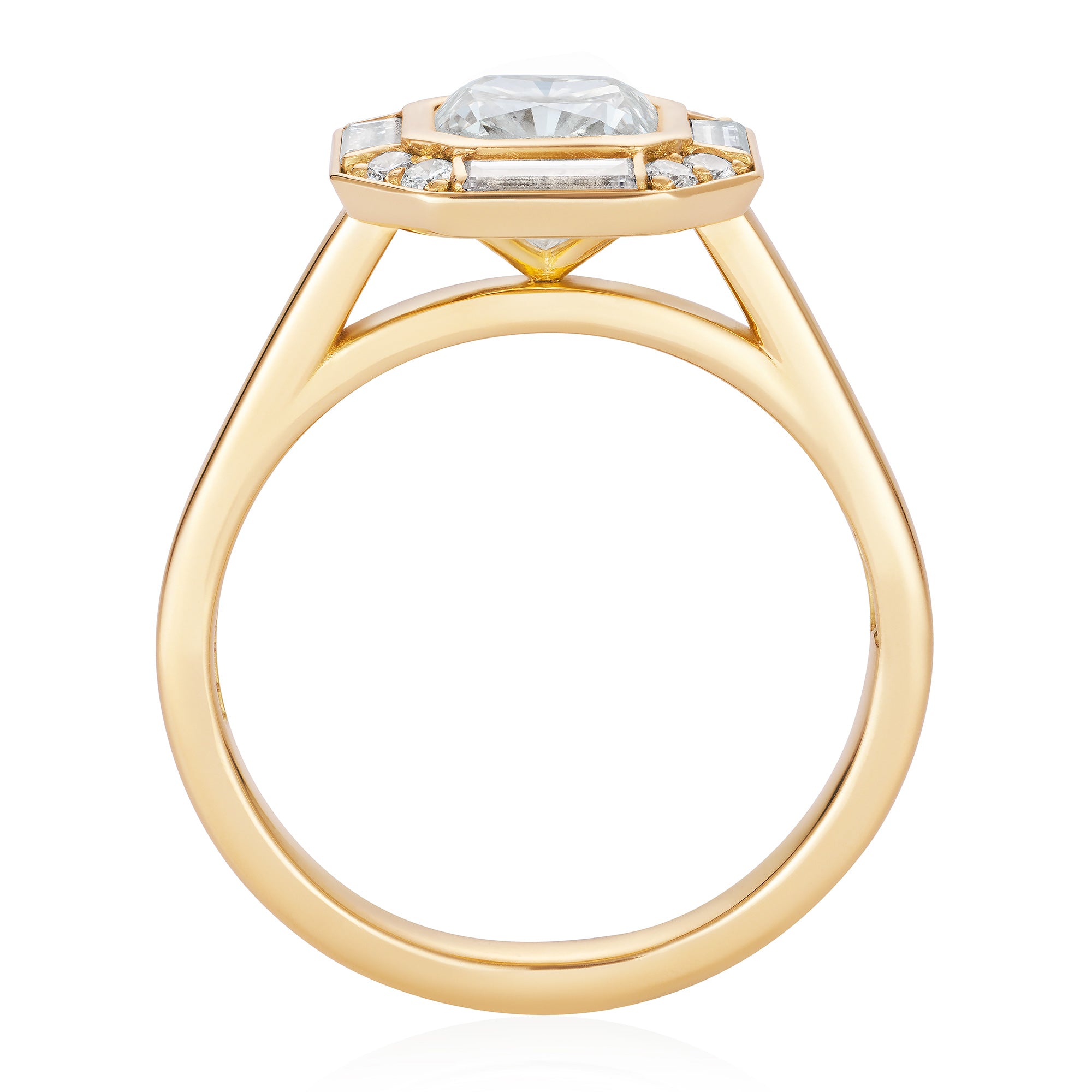 Yellow gold engagement ring with a warm cushion cut diamond in a halo of baguette and round diamonds. Designed by Yasmin Everley. Through view.